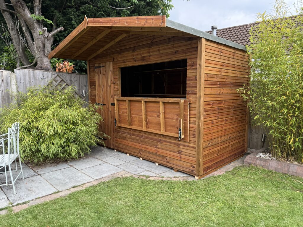 Timber bar shed with an overhang on concrete base