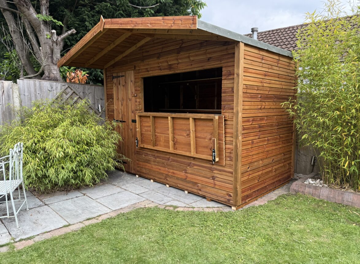 Timber bar shed with an overhang on concrete base