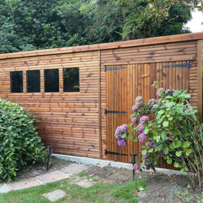 A large pent heavy duty shed with four windows and a double door