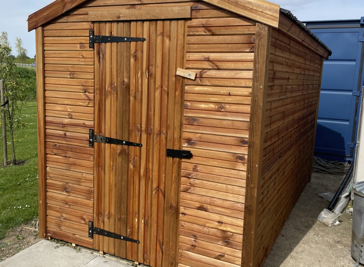 Small apex shed with a single door and onduline roofing
