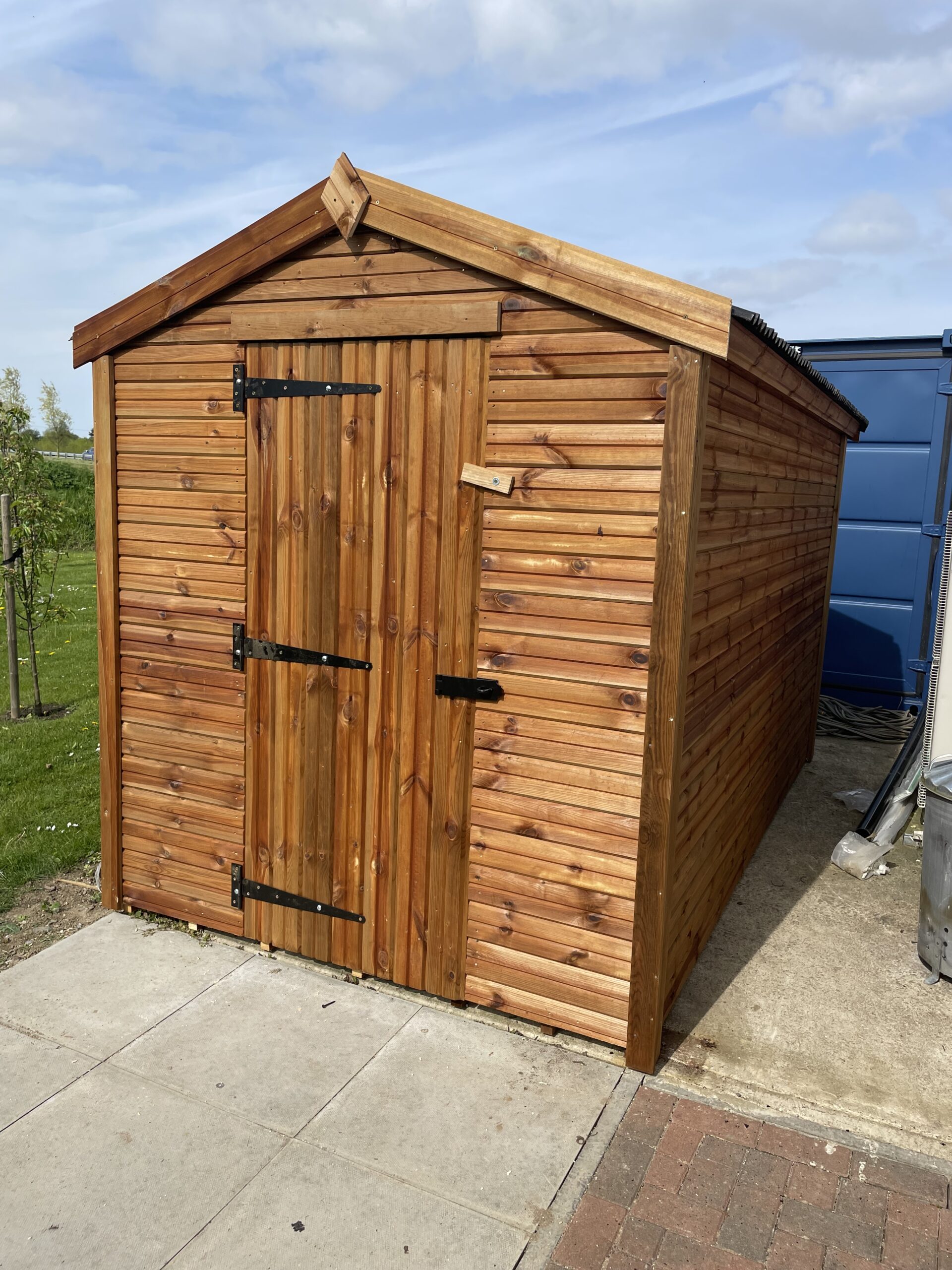 Small apex shed with a single door and onduline roofing