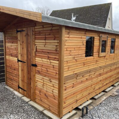 Apex summer shed with a single door, opening side windows and an overhang.