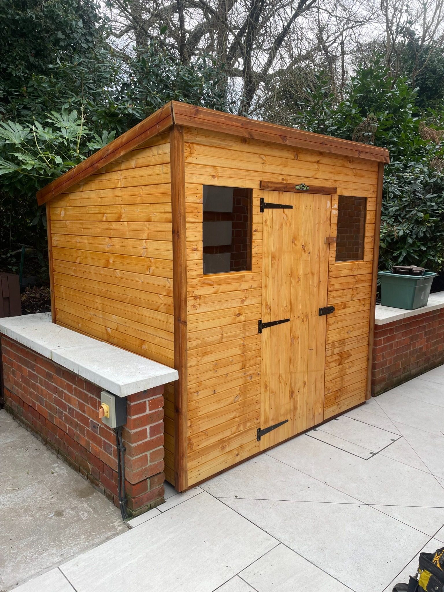 Small pent shed that typically fits within common UK planning height limits