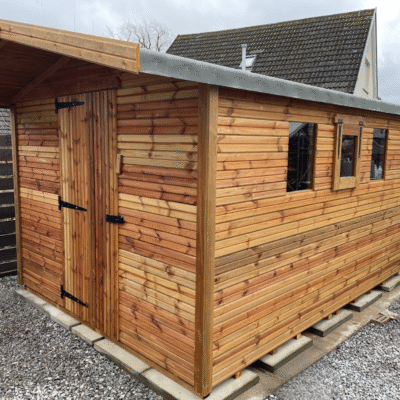 A large apex summer shed with 3 windows and a 4 foot overhang