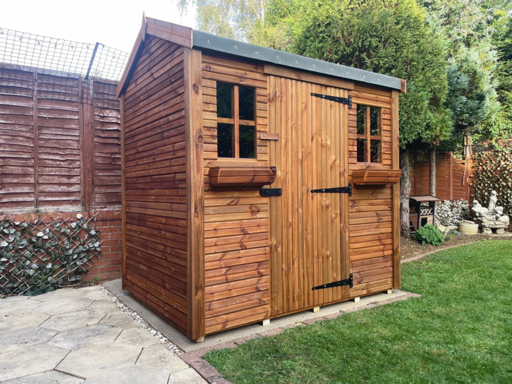 A apex garden shed with two summer windows and a wide door