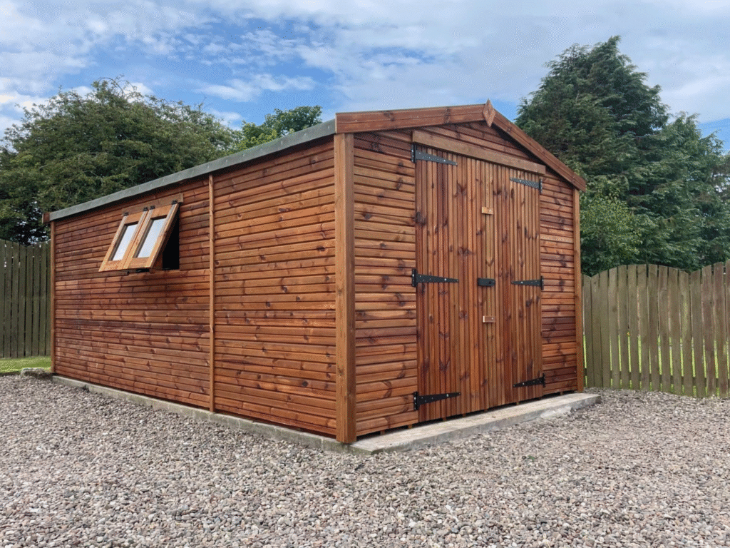 A large heavy duty garden shed with two opening windows and a double door